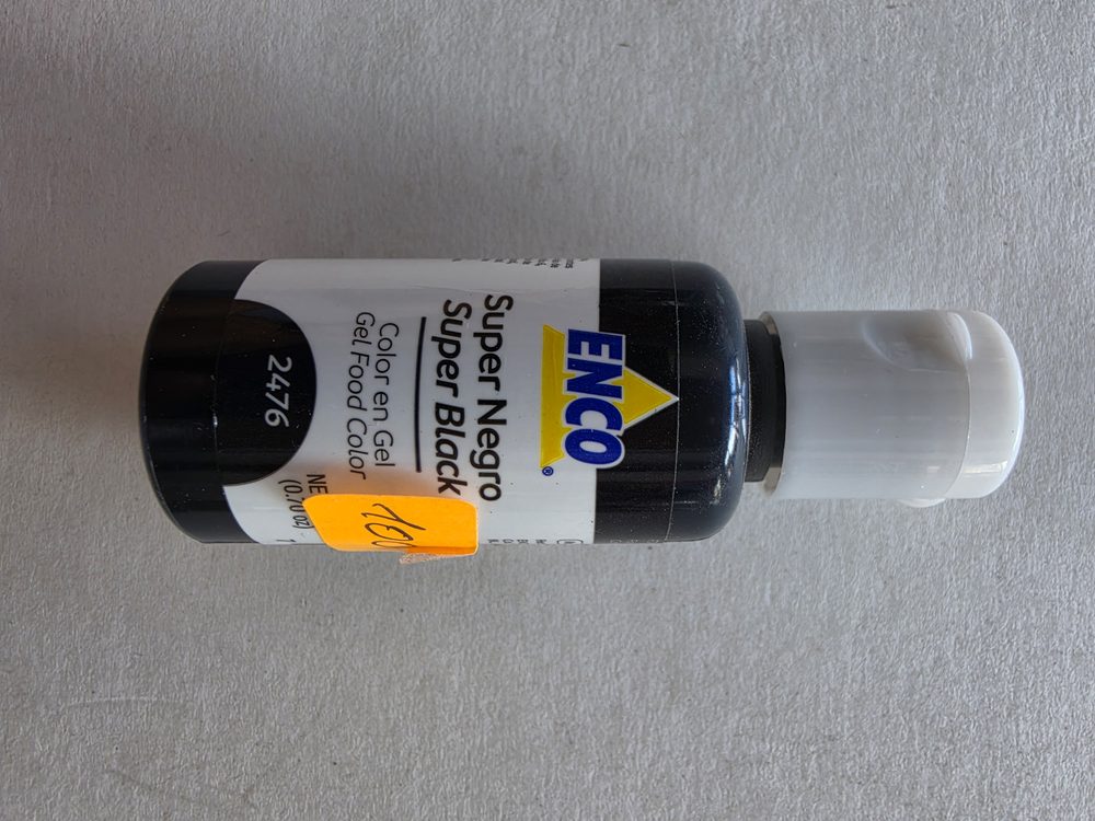 Frasco de colorante en gel negro marca ENCO, envase oscuro con tapa