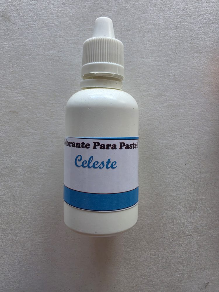 Frasco plástico blanco de colorante liquido celeste para pasteles