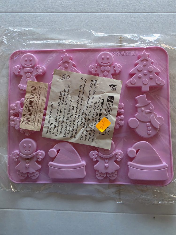 Molde de silicón rosado rectangular con figuras navidenas (galletas